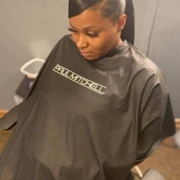 Client at Molly’s House of Beauty in the styling chair with a sleek tapered short cut